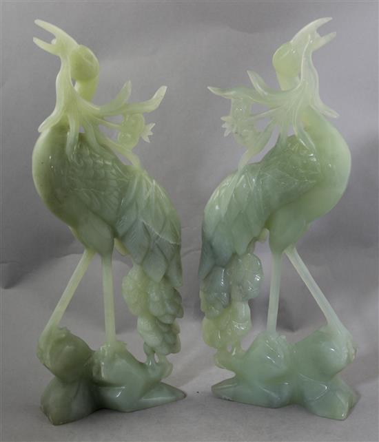 A pair of large Chinese bowenite jade figures of cranes, 20th century, 36.5cm